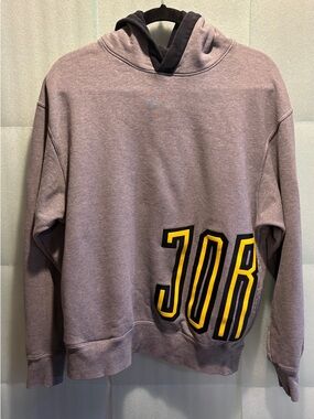 Jordan Gray Hoodie with Black and Yellow Graphic. Jumpman logo and double pocket